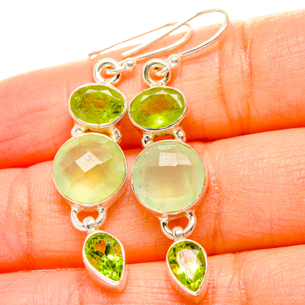 Sterling silver hook earrings with three green stones, small oval and round drops