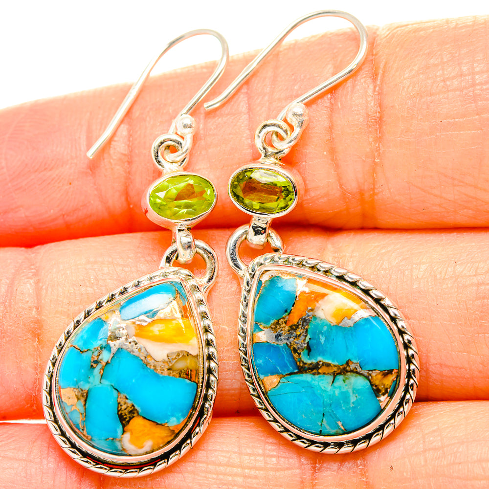 Teardrop turquoise drop earrings with green peridot accents and silver-tone hooks