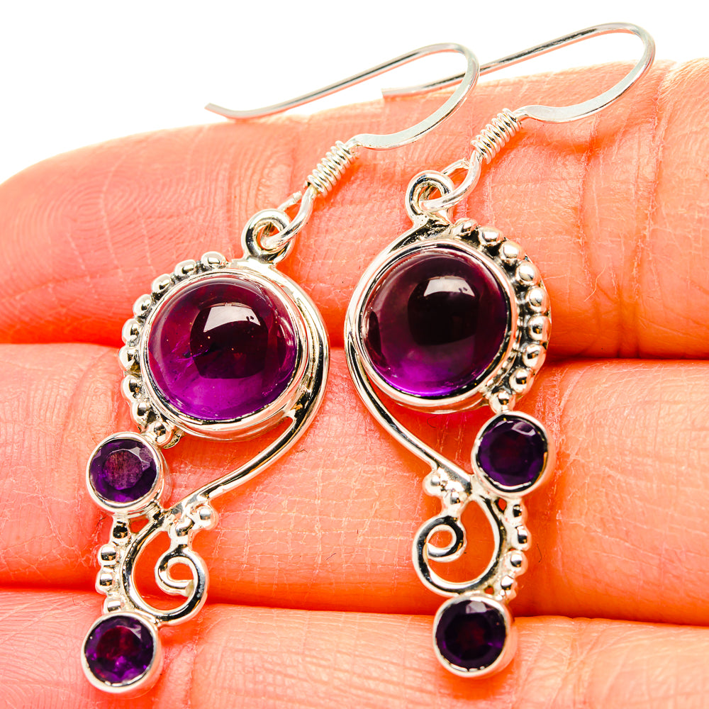 Amethyst and sterling silver drop earrings with oval and round purple stones