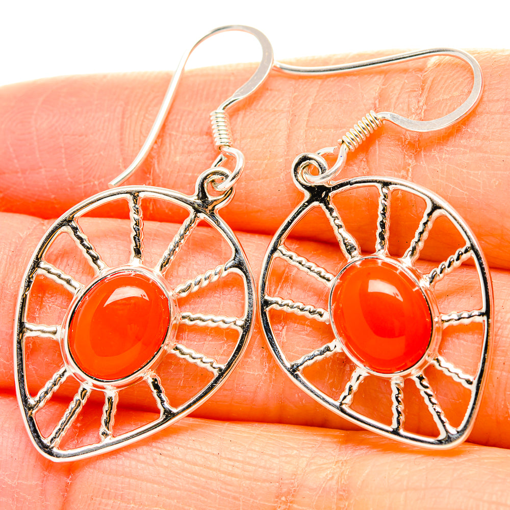 925 silver drop earrings with orange carnelian cabochon in wheel frame