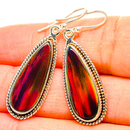 Sterling silver teardrop earrings with iridescent red-purple opal-like stones