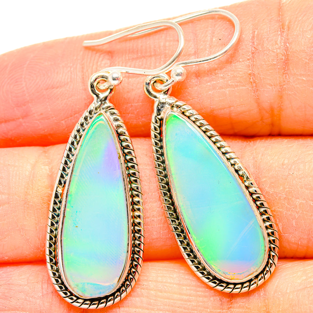 925 sterling silver opal teardrop earrings with rainbow iridescent stone and rope border