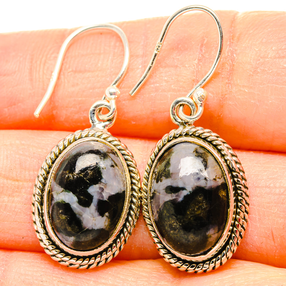 Oval dark green stone drop earrings with white veining, silver rope bezel