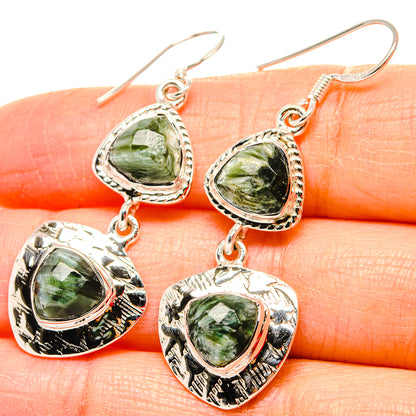Seraphinite heart-shaped dangle earrings, green cabochon with ornate silver border, 925