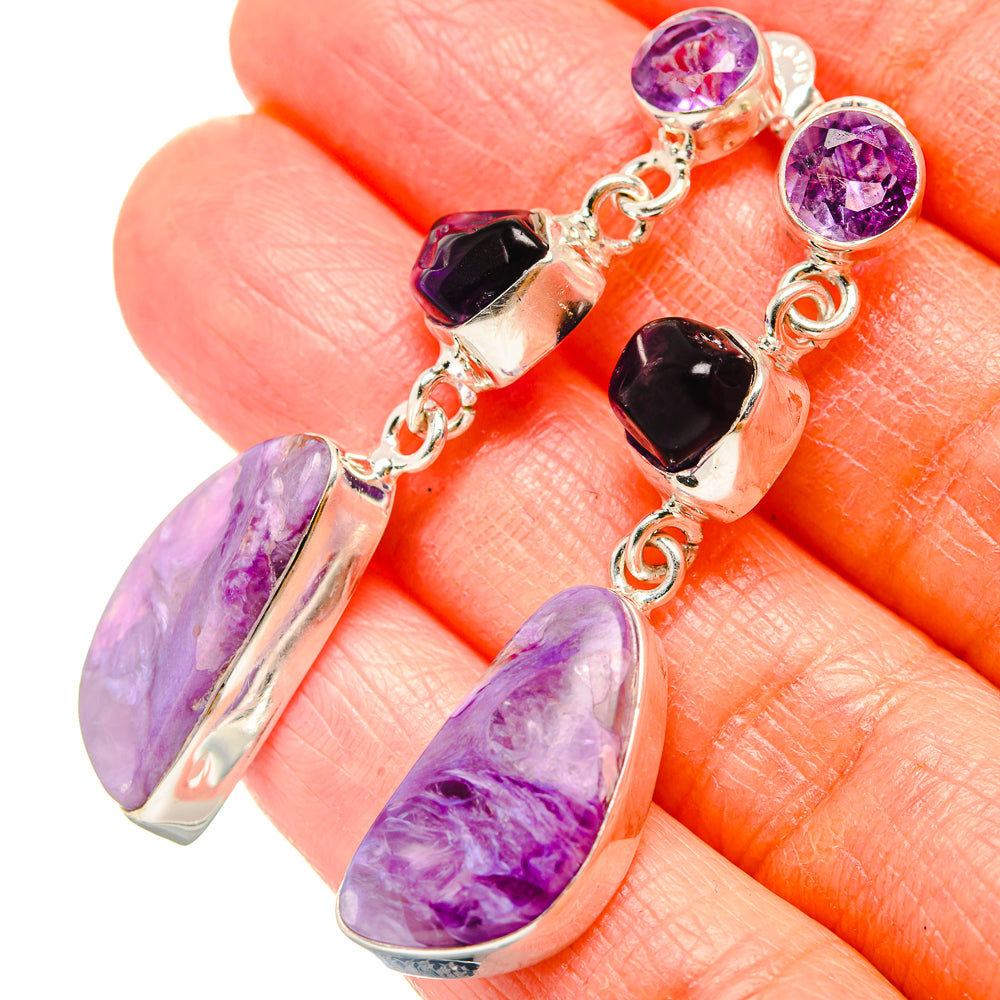 Sterling silver drop earrings with purple amethyst and dark stone charms