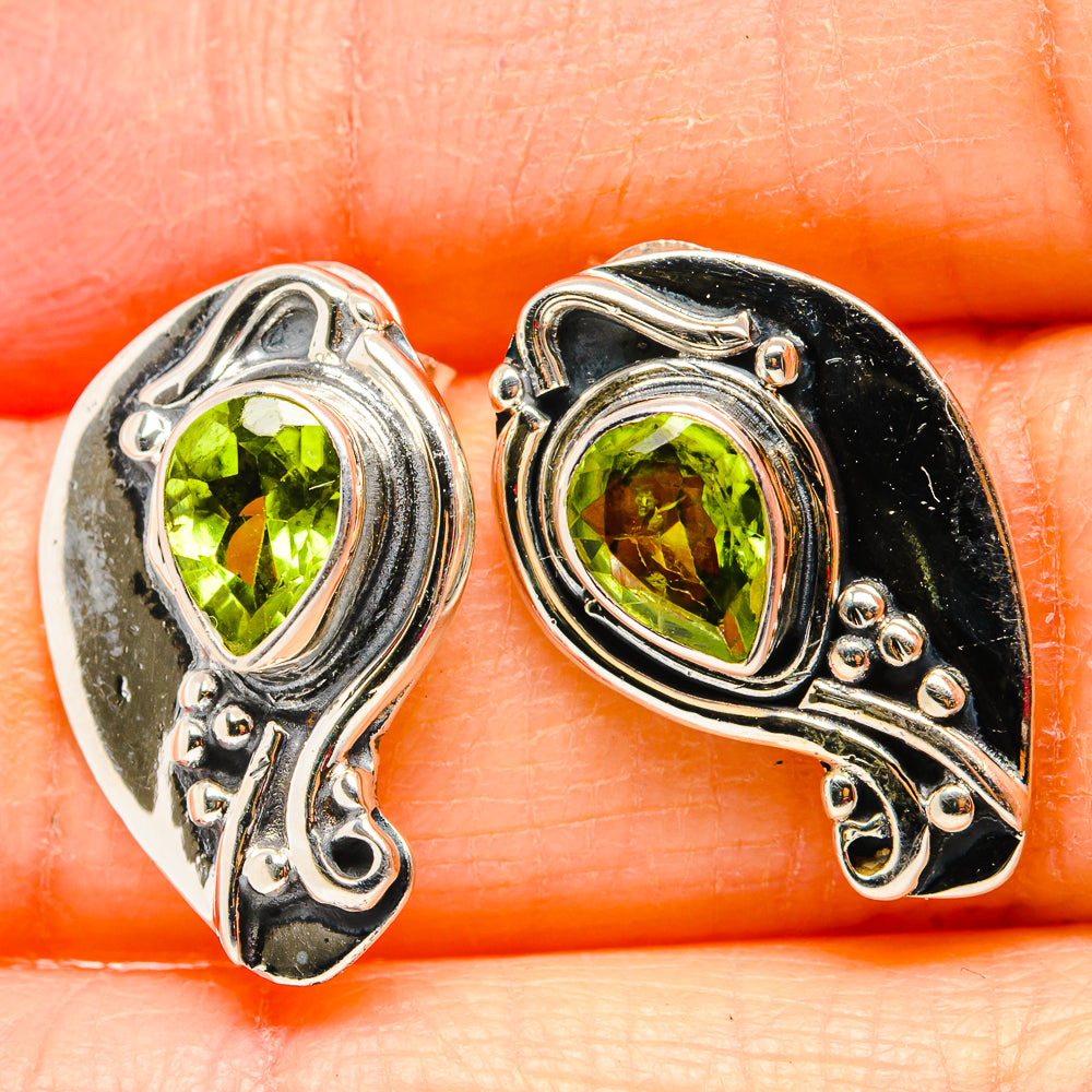 925 sterling silver peridot earrings close-up, oval green stones in ornate frames
