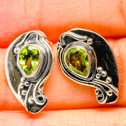 925 sterling silver peridot earrings close-up, oval green stones in ornate frames