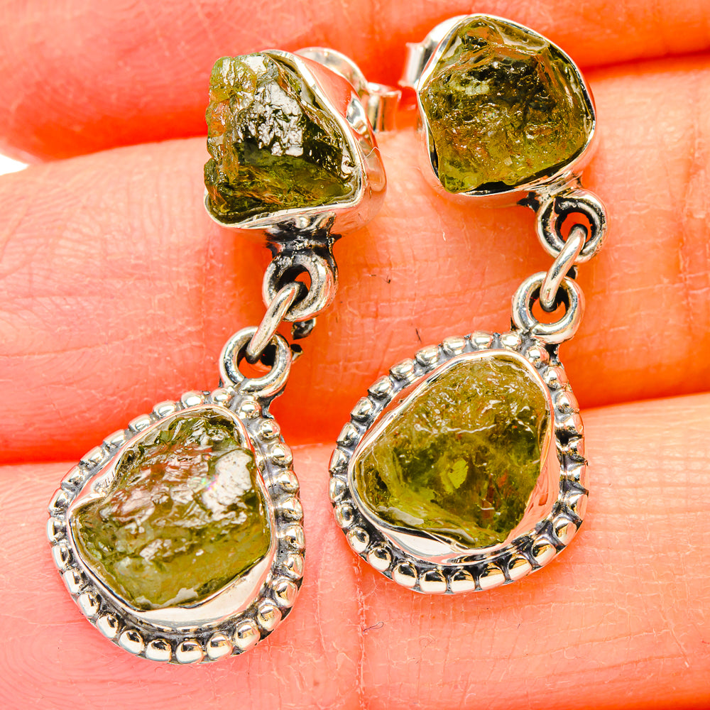 Sterling silver dangle earrings with rough green peridot teardrop drops and chain links