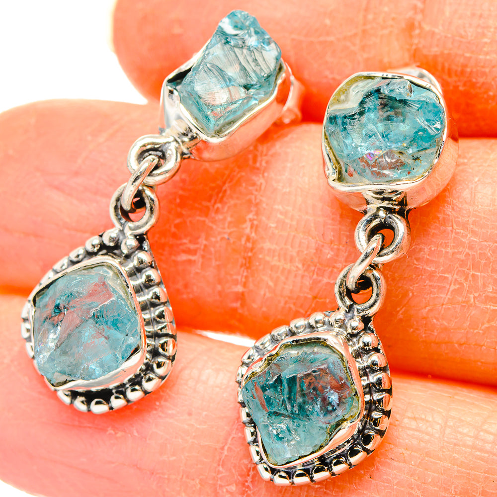 Silver drop earrings with rough turquoise apatite stones and dangling charm links