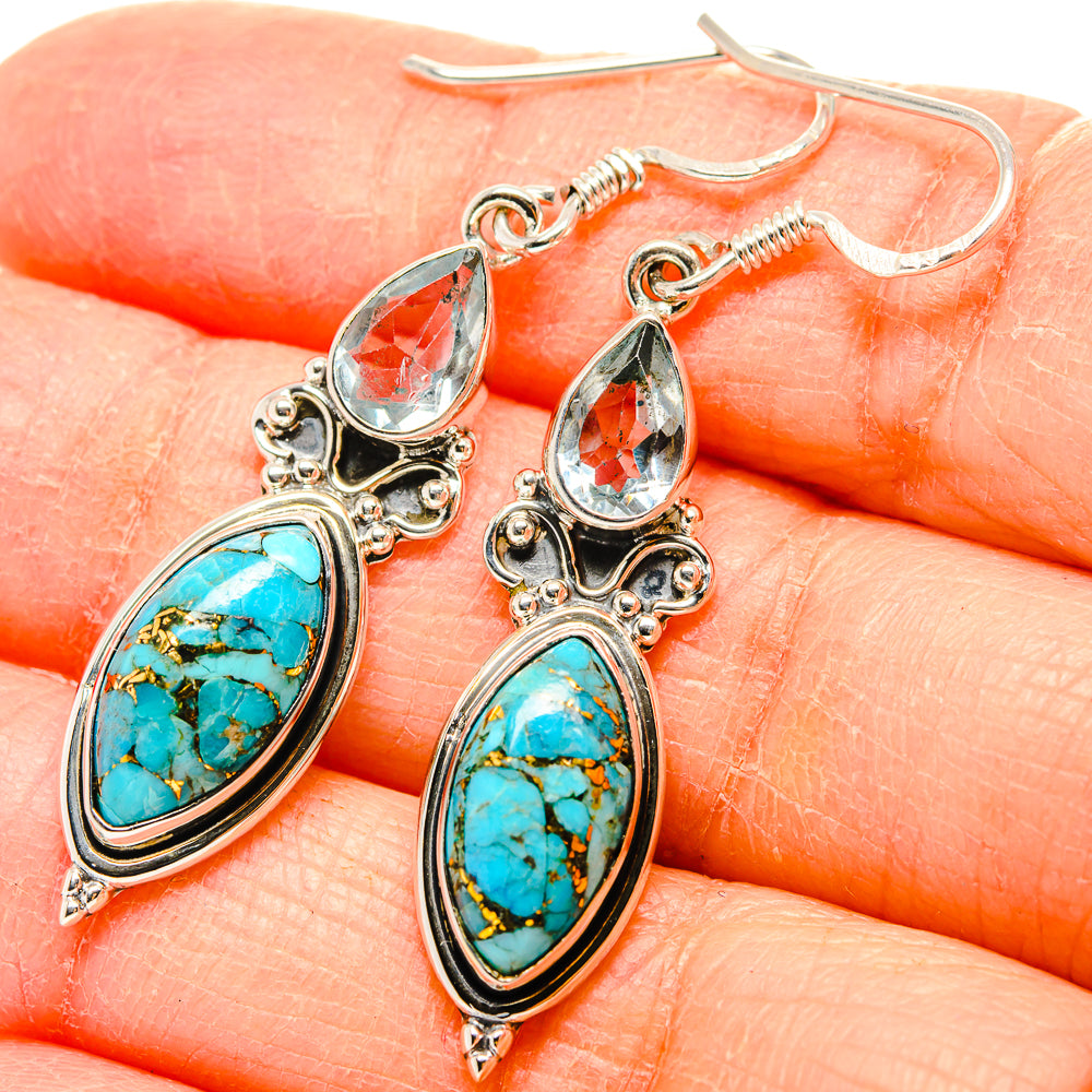 Turquoise and blue topaz drop earrings in 925 sterling silver, closeup of oval and teardrop stones