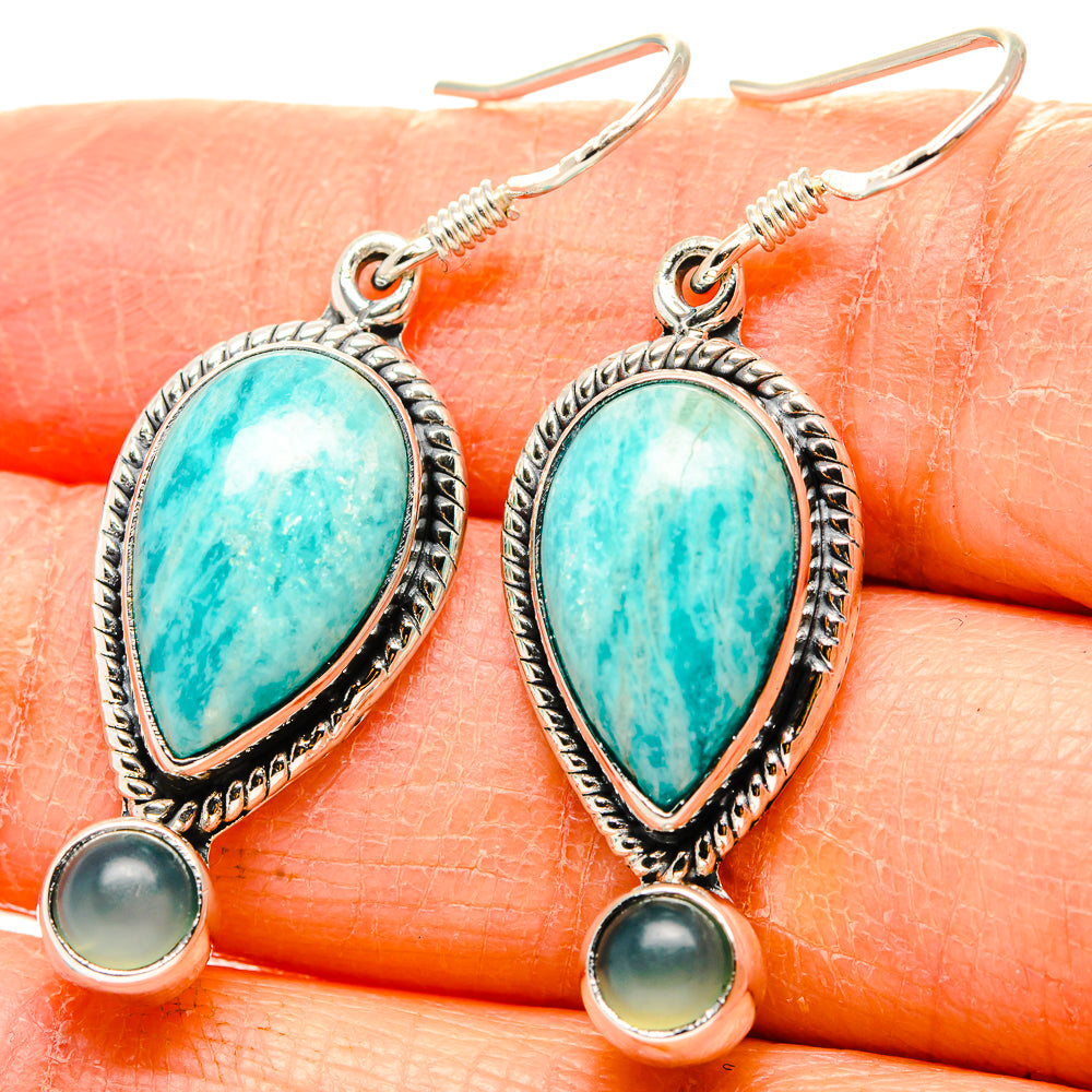 Close-up: sterling silver drop earrings with turquoise teardrop and round aqua stones