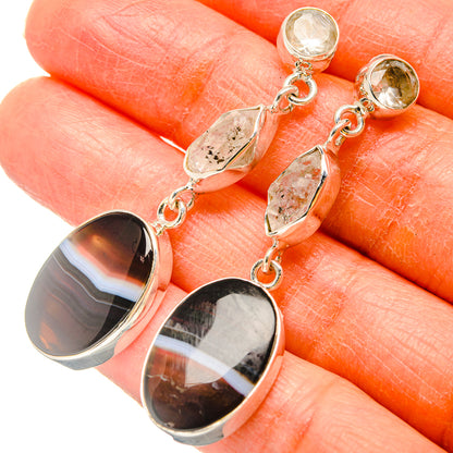 Sterling silver dangle earrings with striped dark agate and clear quartz teardrops
