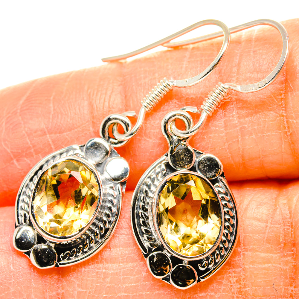 Sterling silver citrine drop earrings with faceted oval stones, beaded border, and studs