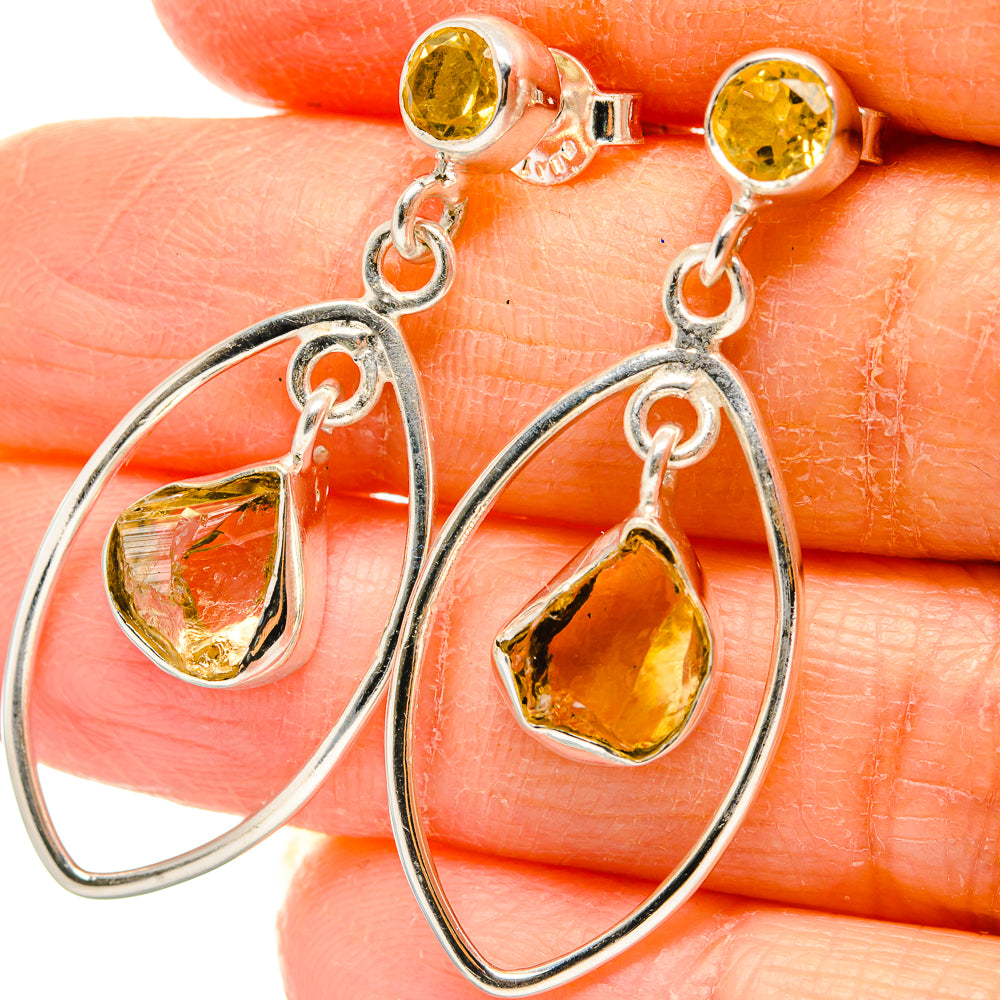 Faceted citrine teardrop earrings with dangling silver hoop frames
