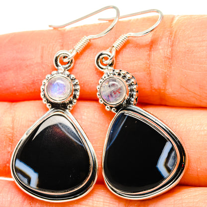 Sterling silver dangle earrings with opalescent round top and black teardrop stones