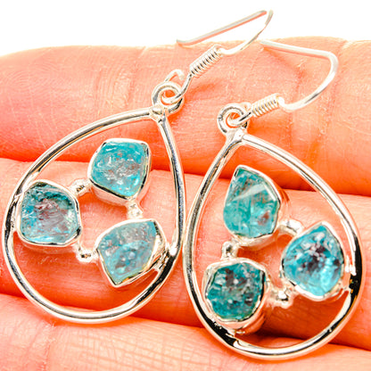Sterling silver hoop earrings with rough turquoise apatite stones, teardrop drops
