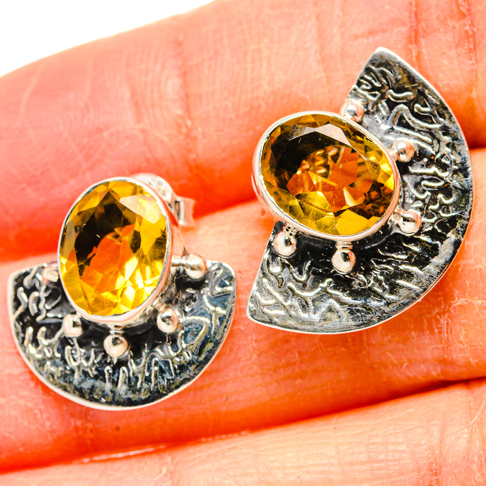 Faceted citrine earrings in 925 sterling silver with ornate teardrop filigree setting