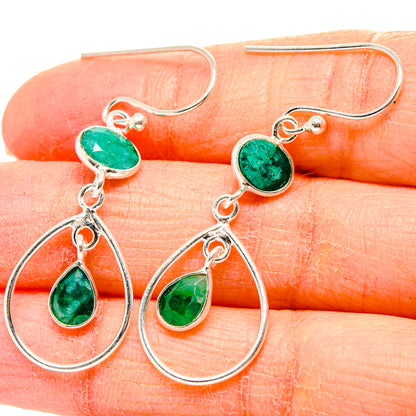 Sterling silver drop earrings with green teardrop stones and two-tier hoop charms