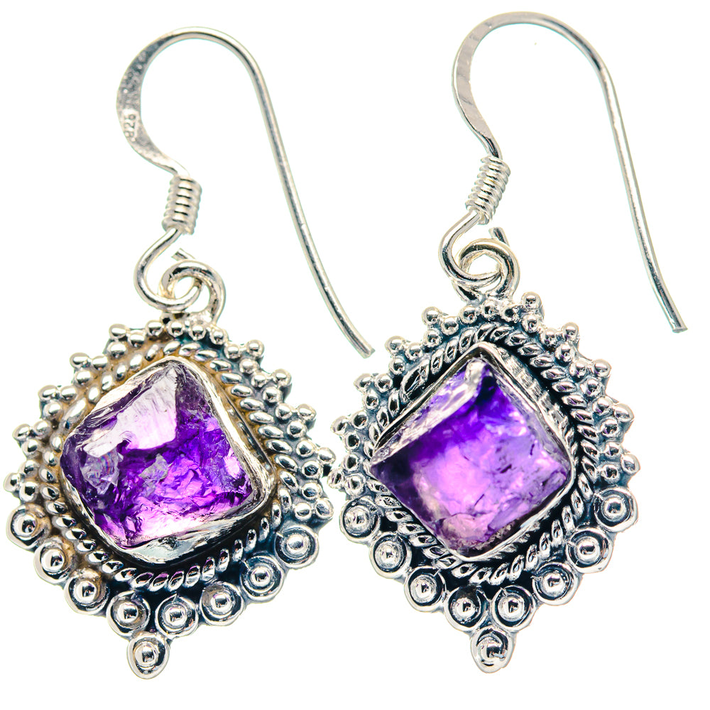 Silver hook earrings with purple rough amethyst teardrop settings and beadwork