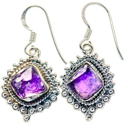 Silver hook earrings with purple rough amethyst teardrop settings and beadwork