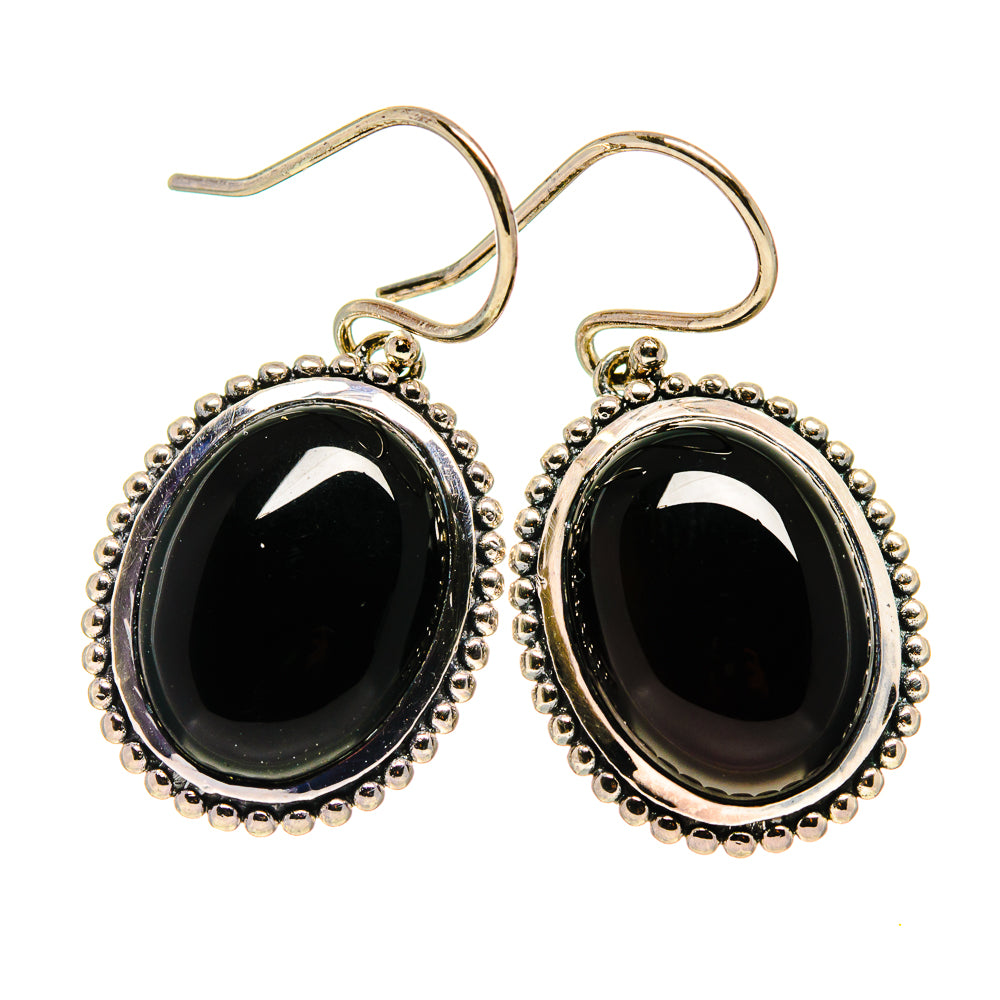 Oval black onyx earrings in silver with beaded halo settings and curved hook backs
