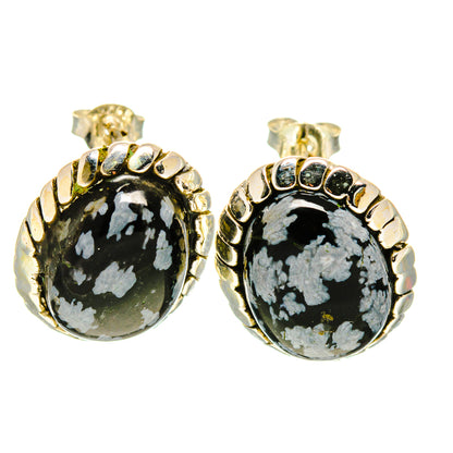 Snowflake obsidian stud earrings: round black cabochons with white veining, gold-tone setting