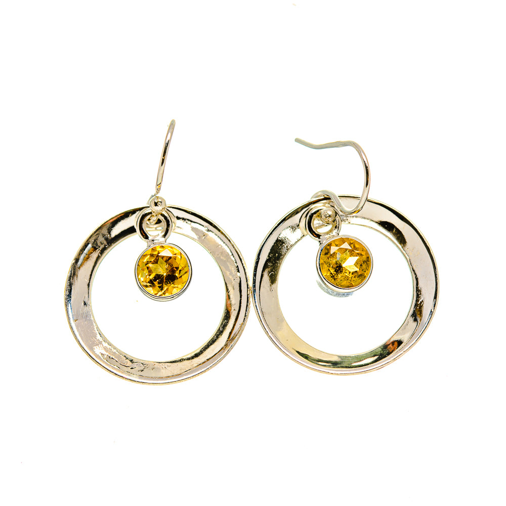Sterling silver hoop earrings with round faceted citrine drops and hinged hooks.