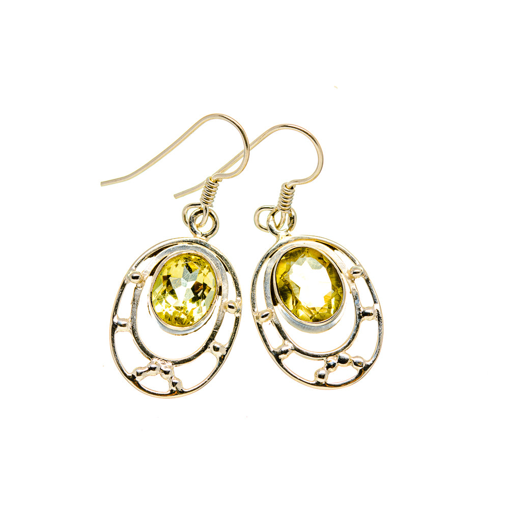 Sterling silver dangling citrine earrings with faceted oval yellow stones and ornate oval settings