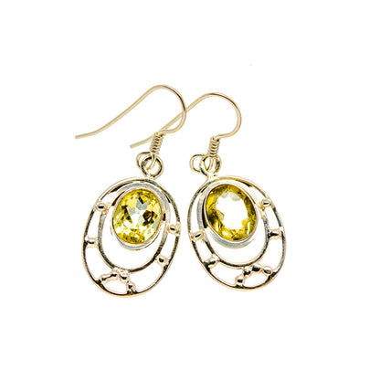 Sterling silver dangling citrine earrings with faceted oval yellow stones and ornate oval settings