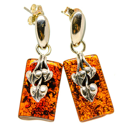 Amber resin dangle earrings with silver-tone top and rectangular black-orange panels