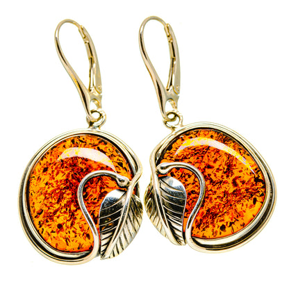 Round amber cabochon drop earrings in silver bezel with gold-tone hooks