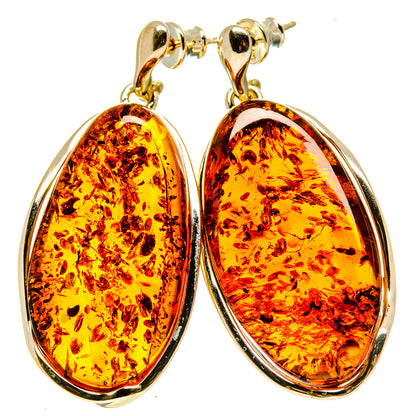 Teardrop amber earrings in gold-tone setting with 925 sterling silver hooks
