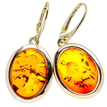 Oval amber drop earrings with 925 sterling silver bezel and lever hooks
