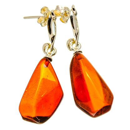 Baltic amber teardrop earrings with gold-tone hooks and orange-red stones