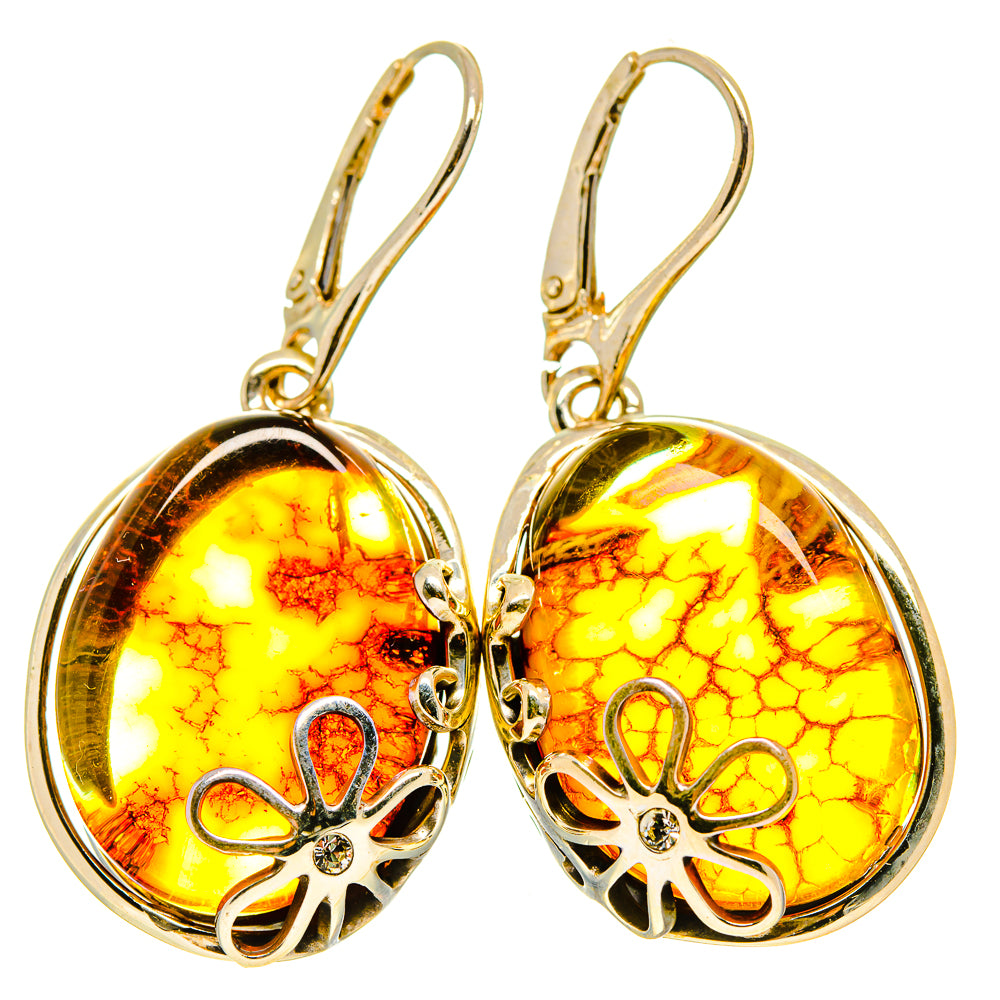 Golden amber cabochon drop earrings with floral cutout frames, 925 sterling silver hooks