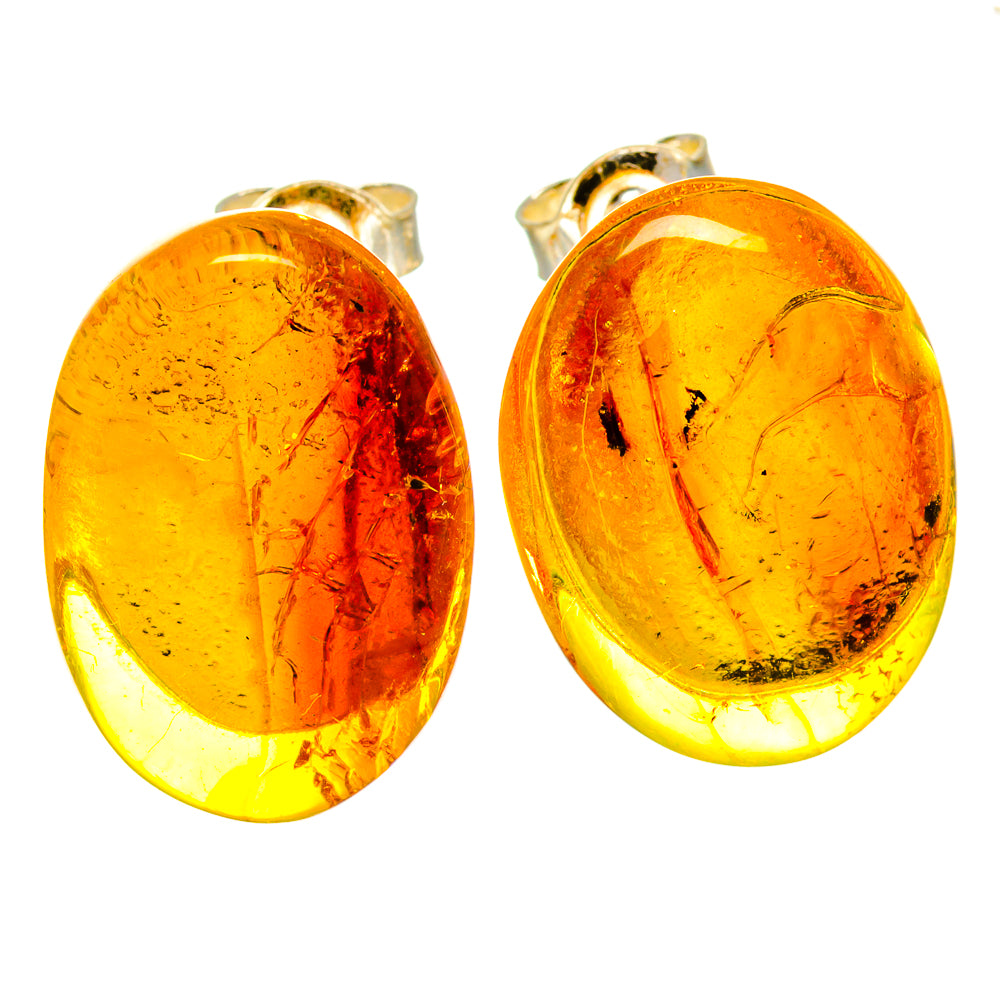 Oval amber cabochon earrings in gold-tone oval settings, stud backs visible
