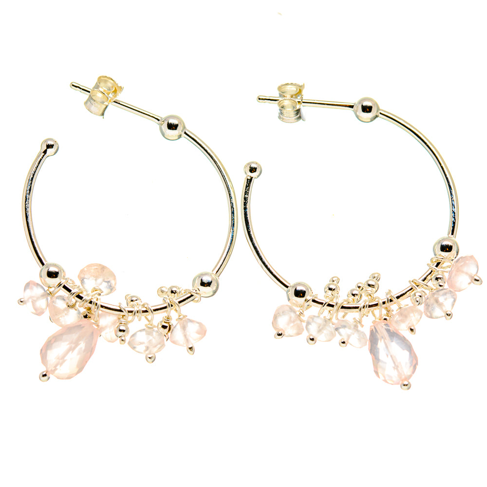 Silver hoop earrings with pink gemstone bead fringe and small dangling charms