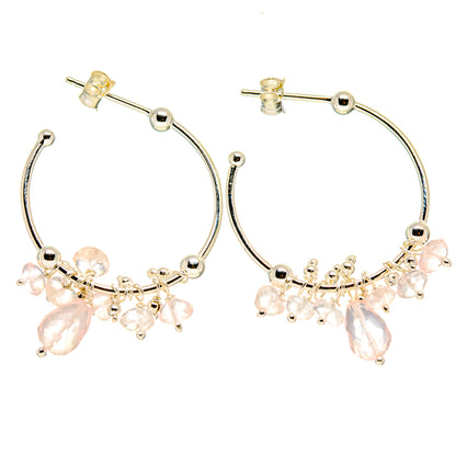 Silver hoop earrings with pink gemstone bead fringe and small dangling charms