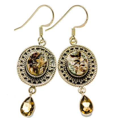 Pair of sterling silver drop earrings with ornate round gemstone and smoky quartz drops