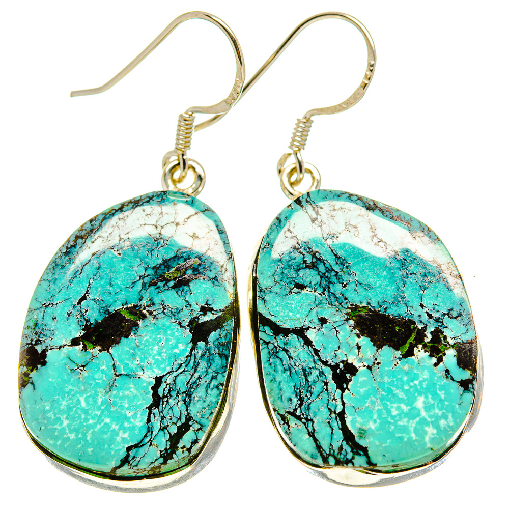Pair of turquoise oval drop earrings with silver-tone hooks and polished bezels
