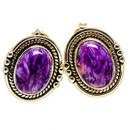 Oval charoite gemstone earrings with ornate gold-tone frames and purple oval cabochons.