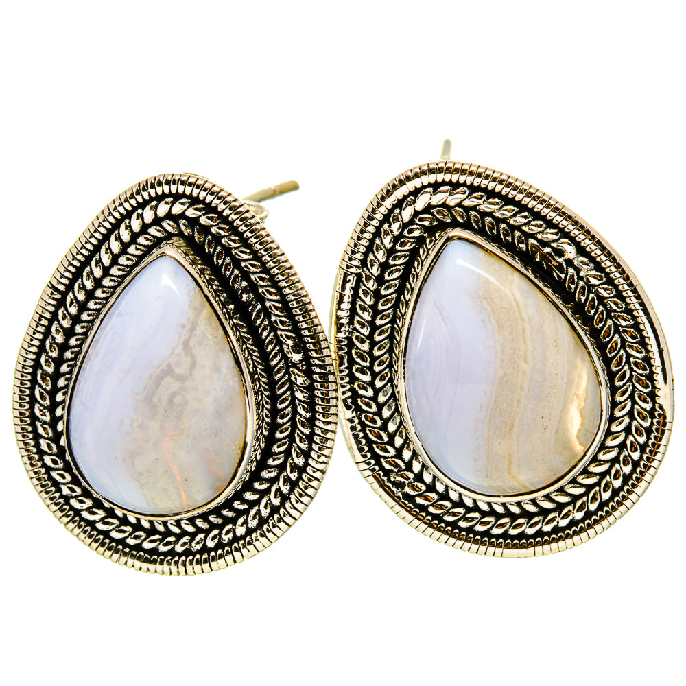 Teardrop gemstone stud earrings with ornate silver filigree and pear-shaped cabochons