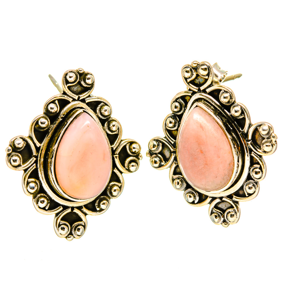 Pink opal teardrop stud earrings with ornate gold-tone filigree and border bezels