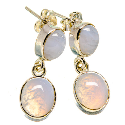 Gold-tone drop earrings with light lavender oval stones and silver ear posts