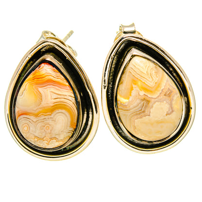 Teardrop agate earrings with gold-tone bezel, cream and orange banded stone, stud posts.