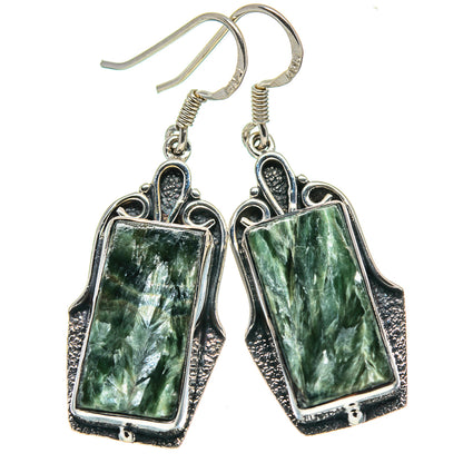 Pair of rectangular green seraphinite earrings, sterling silver hooks with ornate frame.