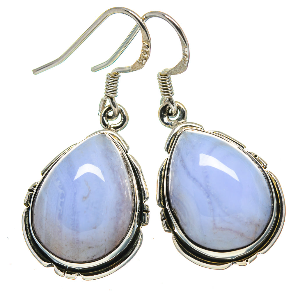 Teardrop blue stone drop earrings with silver-tone fishhook backs and bezel frame