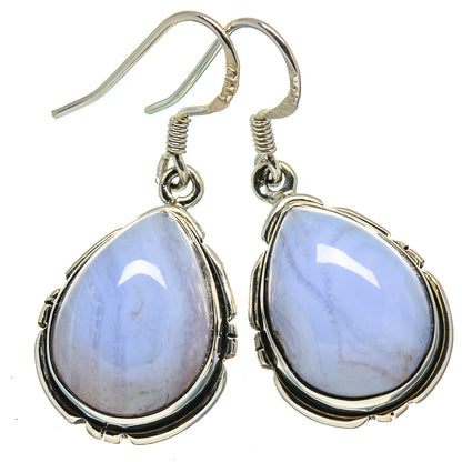 Teardrop blue stone drop earrings with silver-tone fishhook backs and bezel frame