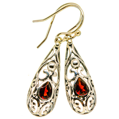 Pair of teardrop filigree earrings with red garnet stones, fishhook style