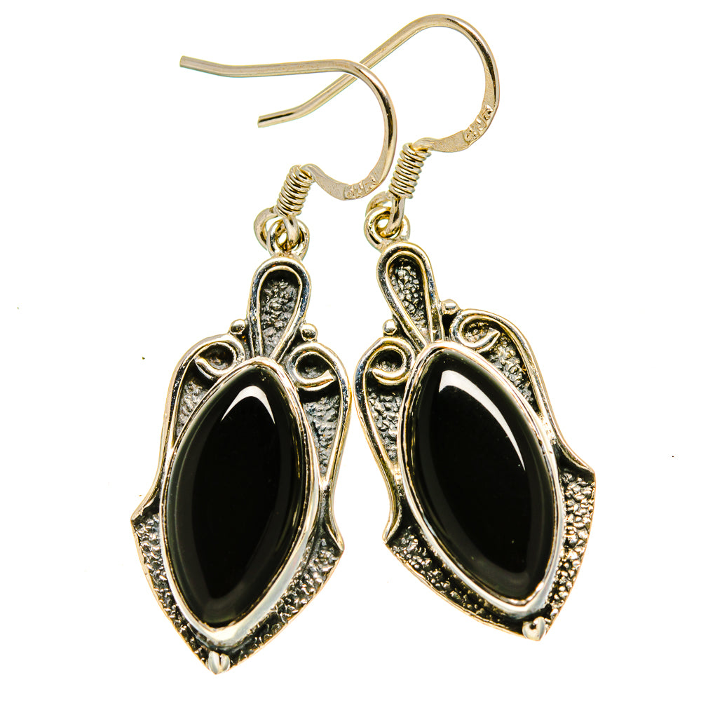 Onyx oval drop earrings with ornate silver-tone settings and fishhook backs